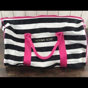 Black and white striped VS duffel bag with pink handles. NWOT never used!